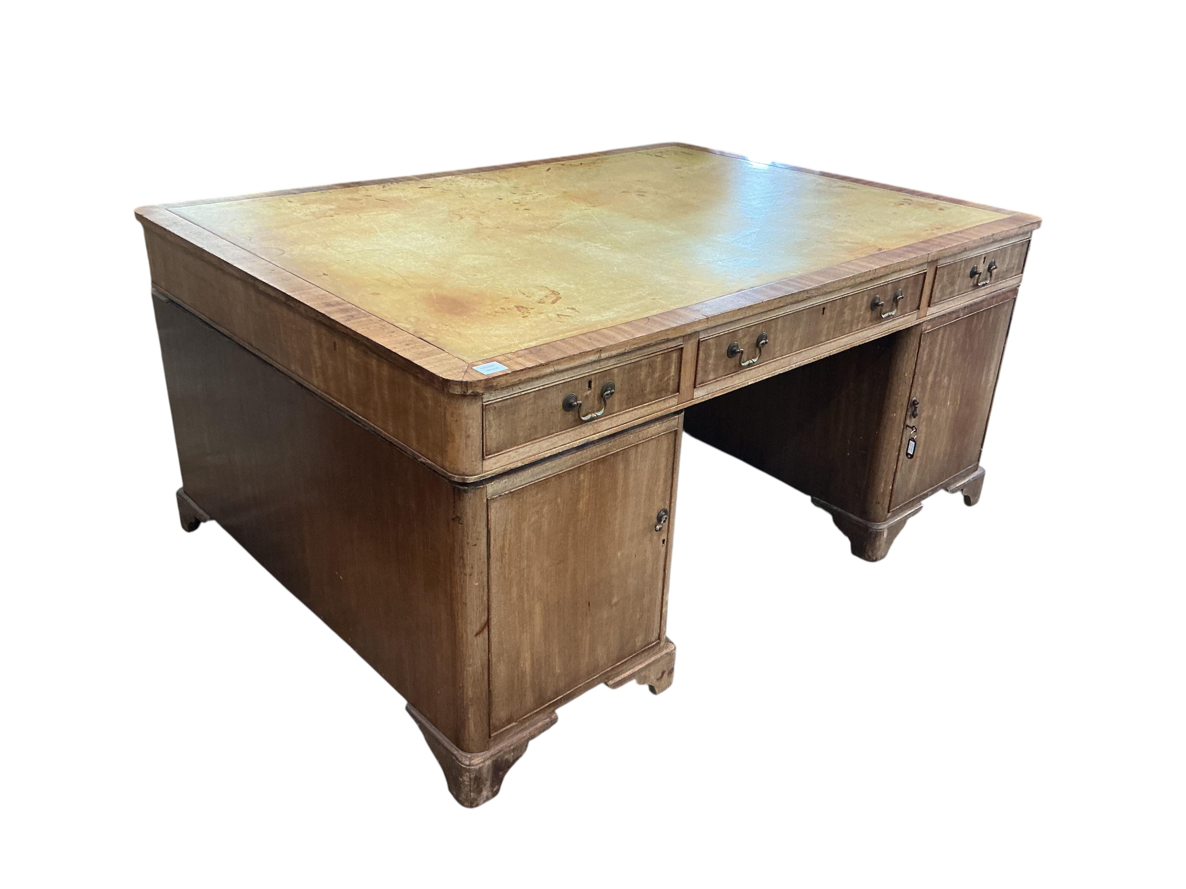 An early 20th century mahogany pedestal partner's desk, width 168cm, depth 122cm, height 78cm